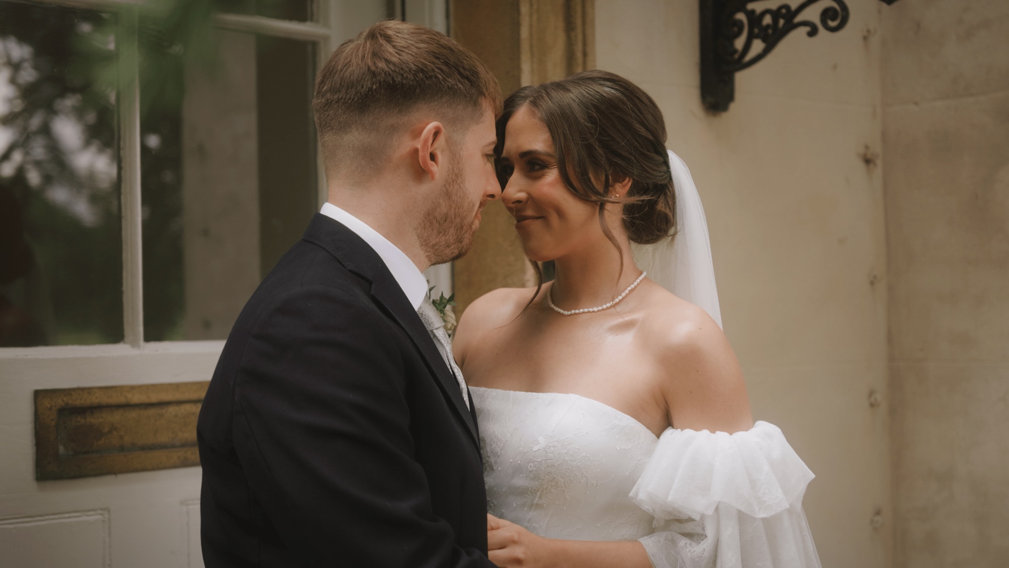 A bride and groom sharing a quiet moment at Aswarby Rectory, Lincolnshire