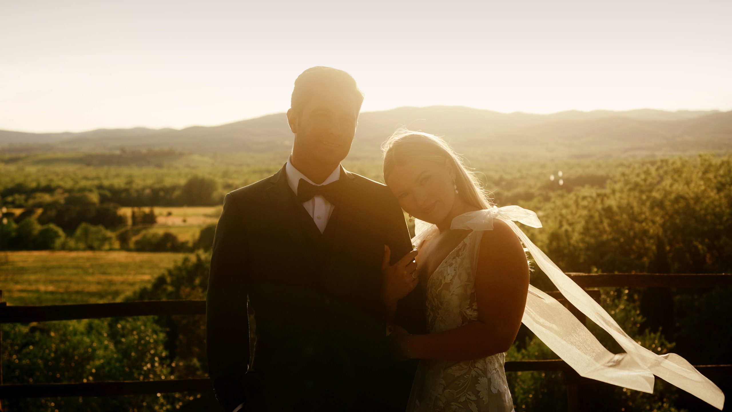 Samantha and Marko at golden hour above the Tuscan hills at Conti di San Bonifacio