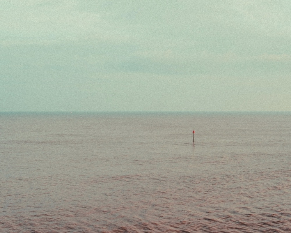 A calm, misty sea shot by George on film