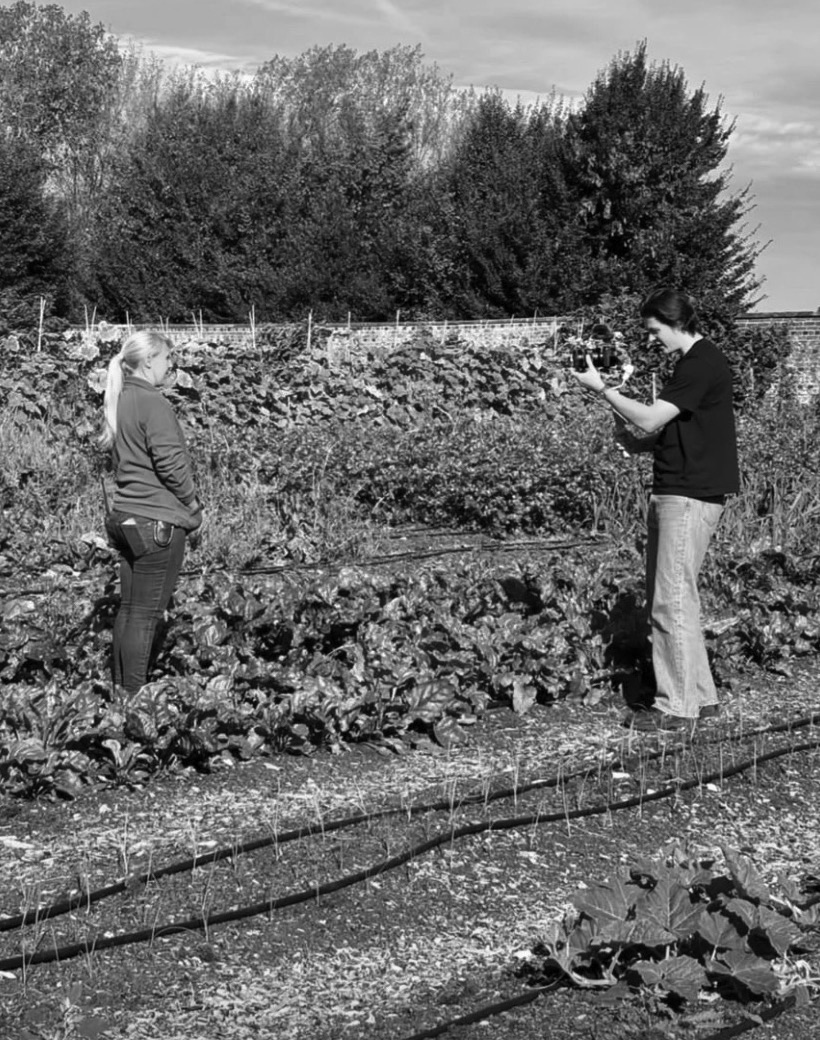 George filming in the walled garden at Doddington Hall, in black and white