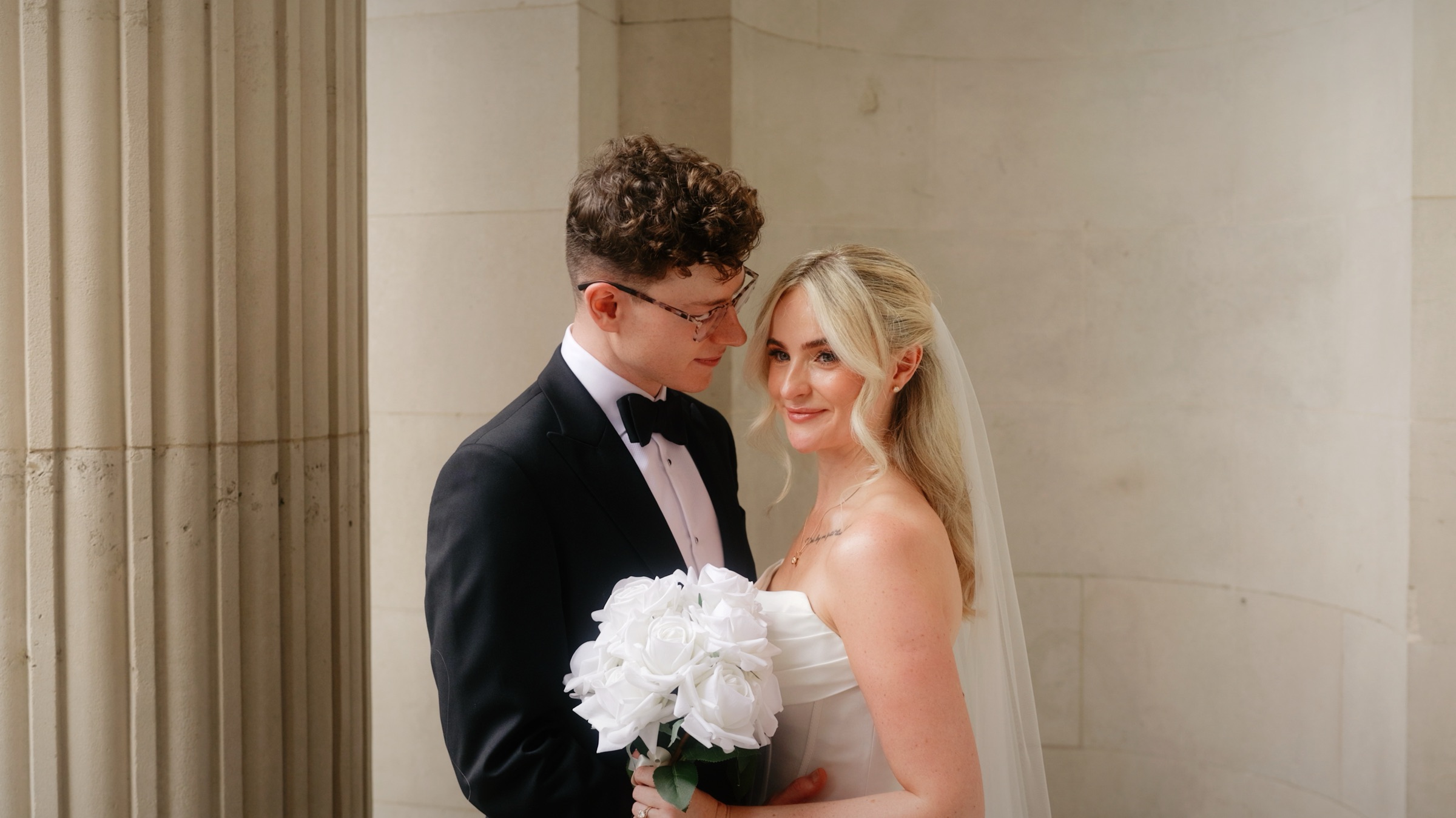 Joe and Hannah between the stone columns at Old Marylebone Town Hall